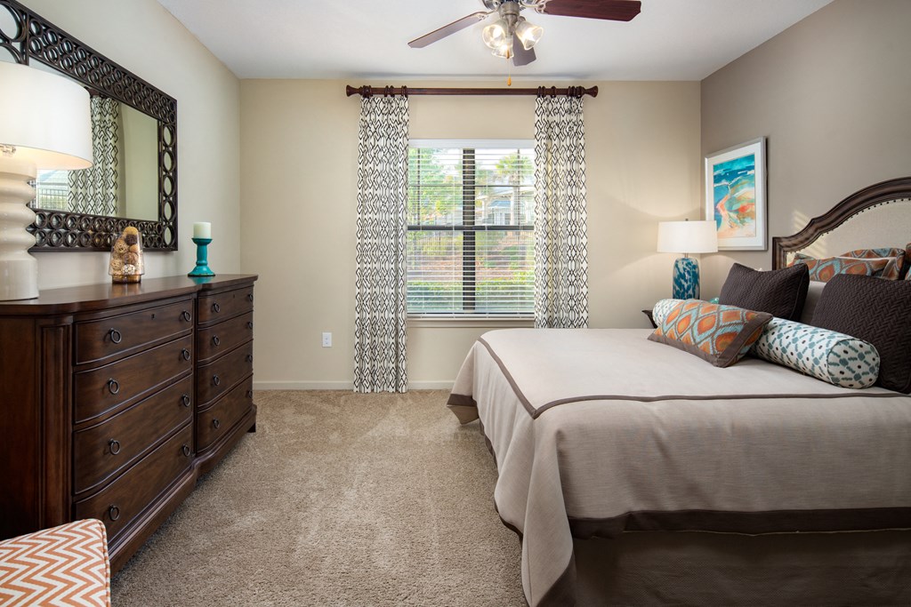 a bedroom with a bed and a dresser