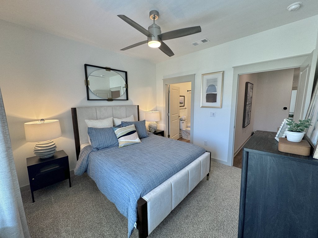 A bedroom with a bed, nightstand, and a ceiling fan at Allier Foley, Alabama