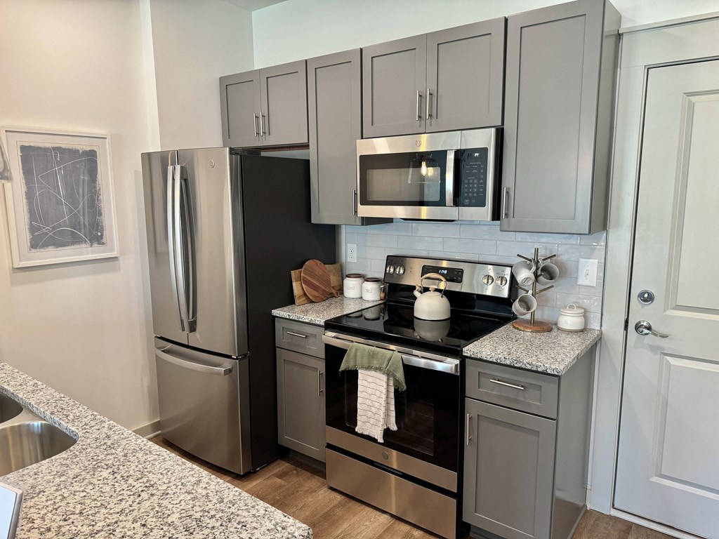 A kitchen with a black refrigerator, stove, and microwave at Allier Foley, Foley, Alabama