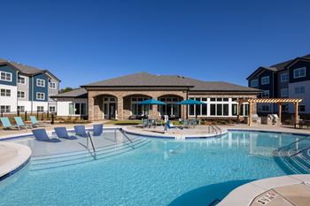 Resort Style Pool with Sun Deck Lounging Area at Fairview Springs in Covington, GA, 30016