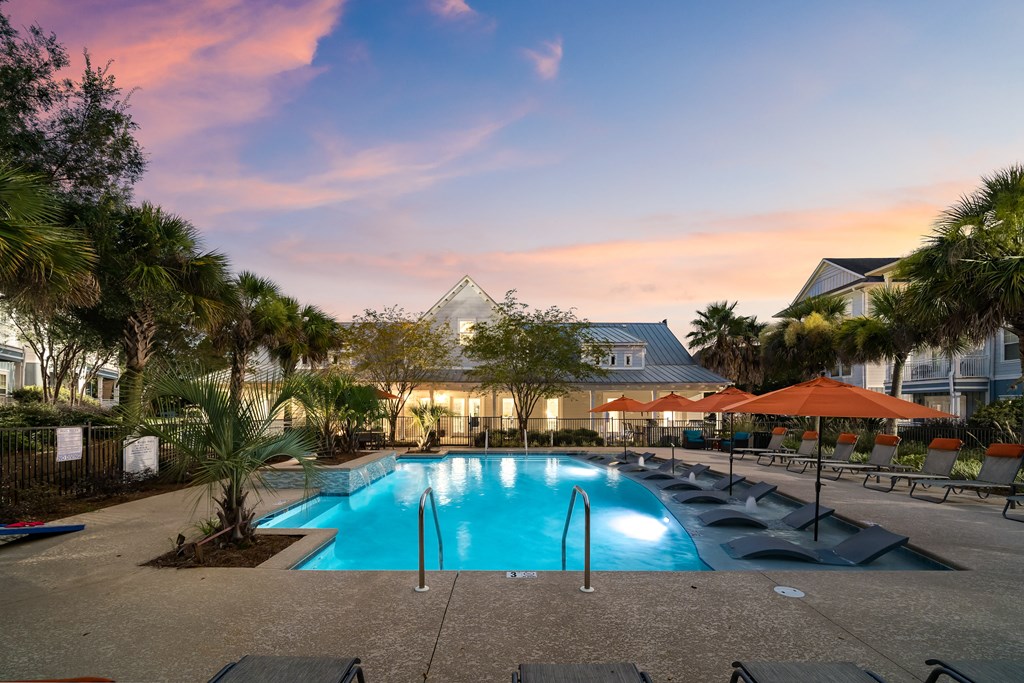 a swimming pool at sunset at the resort at longboat key club