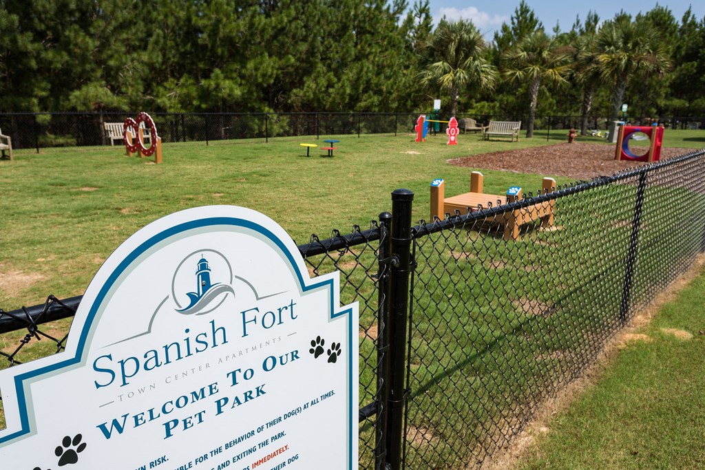 a sign that reads fort in front of a fence