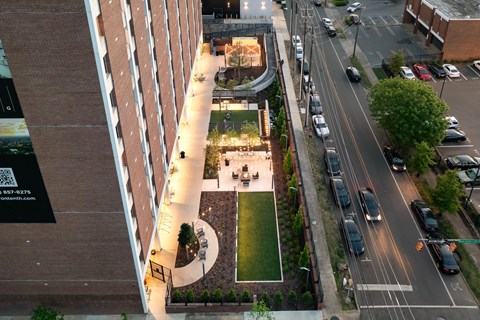 an overhead view of a city street with cars parked on the side of the road at Tower on Tenth Apartments, Birmingham, AL, 35205