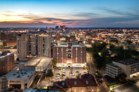 a cityscape at night with the downtown houston skyline in the background at Tower on Tenth Apartments, Birmingham, AL
