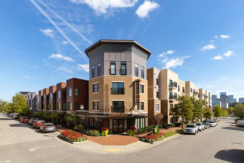 a row of apartment buildings on a city street