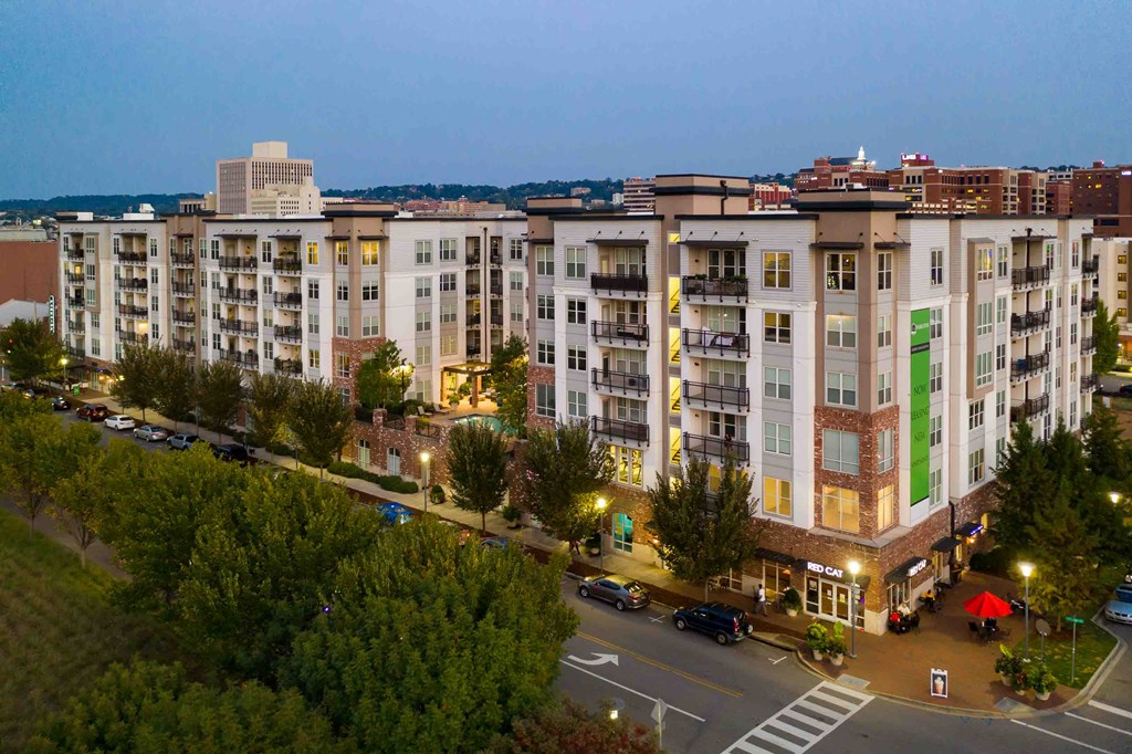 an aerial view of an apartment building in a city at night