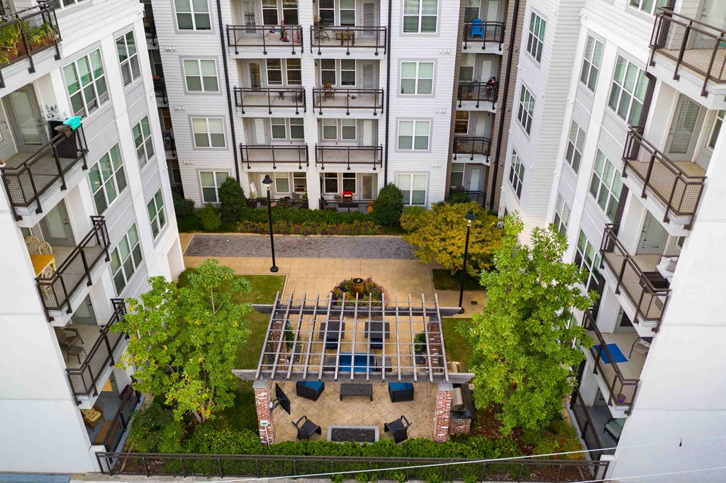 an aerial view of the courtyard of an apartment building