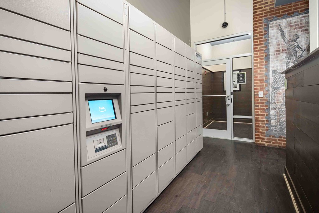 a large white storage room with a computer on the wall