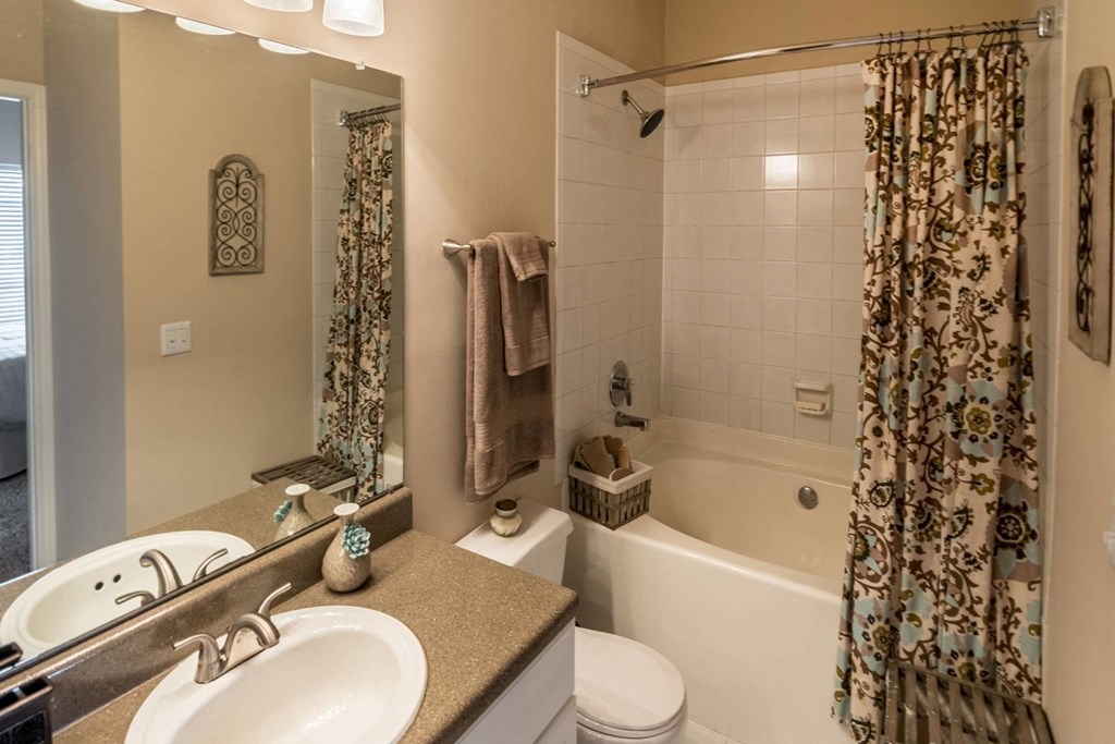 a bathroom with a sink and a toilet and a tub