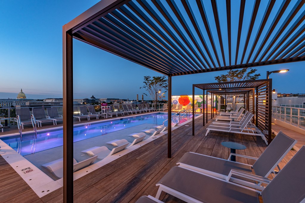 a view of the pool from the roof top of the hotel