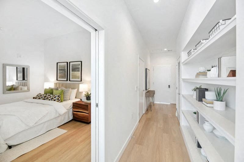 a bedroom with a bed and a book shelf