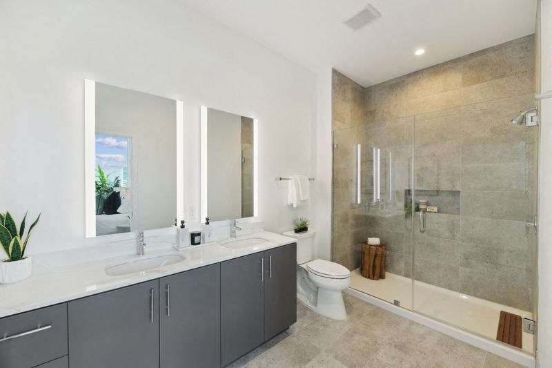 a bathroom with a toilet sink and shower