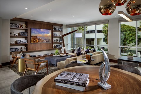 a living room filled with furniture and a large window