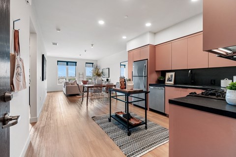A modern kitchen with a dining table and chairs.