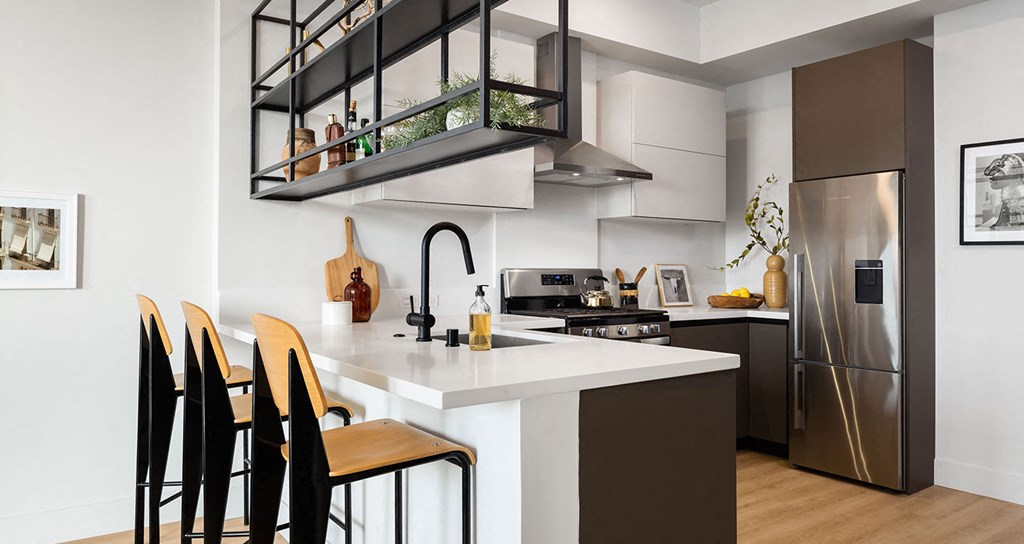 Hanging shelves make for a unique space divider in our one bedrooms
