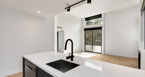 a kitchen with a sink and a window
