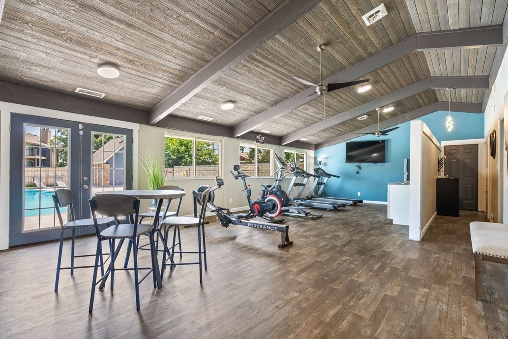 the residence on lamar apartment homes fitness room with exercise bike and table