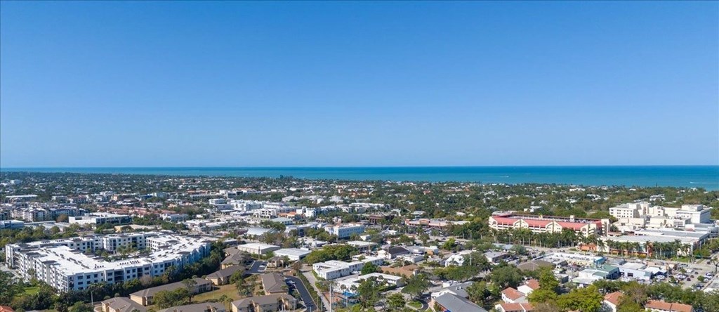 A cityscape with buildings and a clear blue sky.