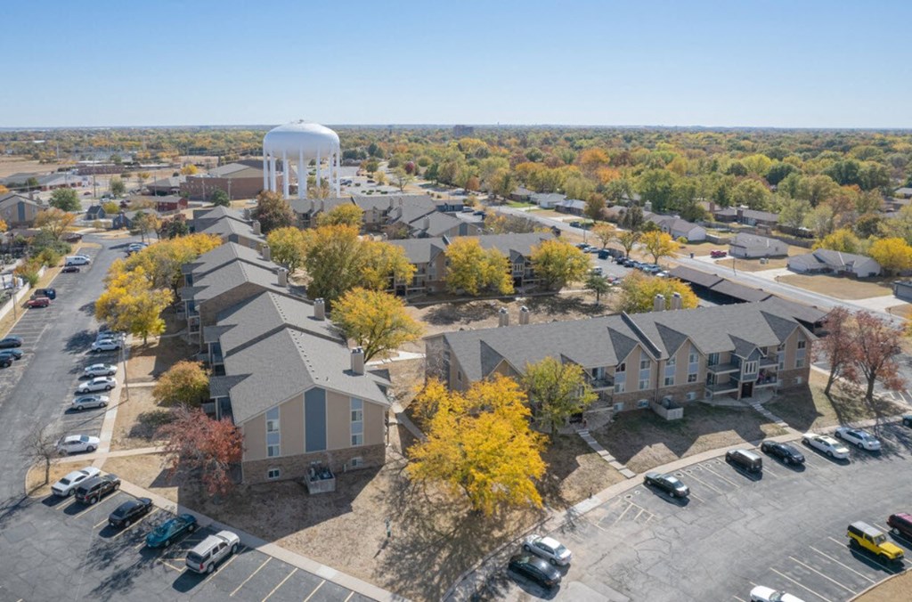 an aerial view of a neighborhood with houses and a water tower