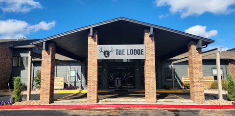 the lodge front of the building with a sign that reads the lodge