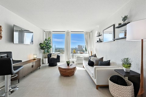 A modern living room with a view of the city.