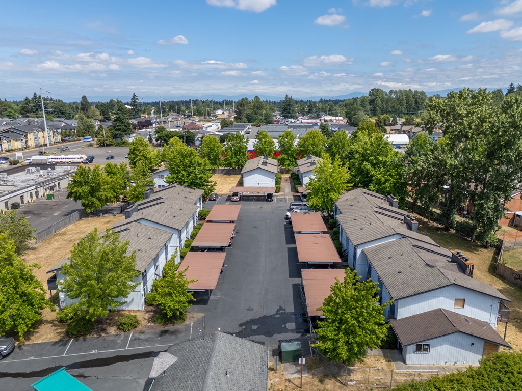 A view of a residential area with houses and trees.