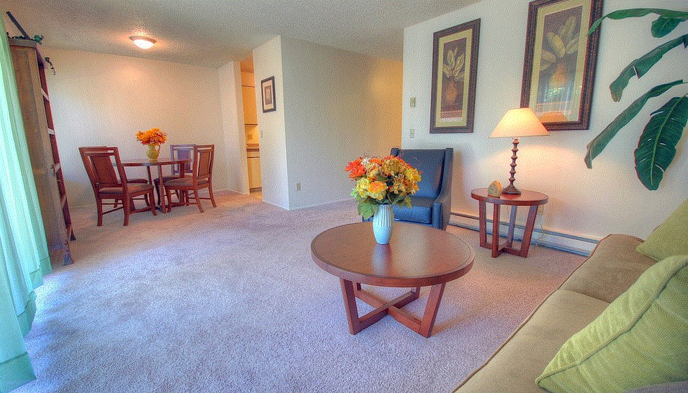 a living room with a couch and a table