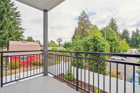 Private patio and balcony available at Alta Crossing Apartments.