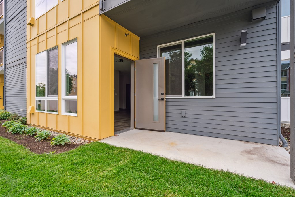 Private patio and balcony available at Alta Crossing Apartments.