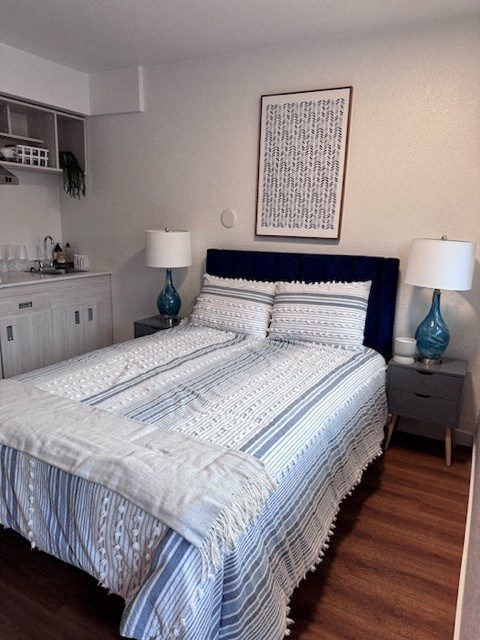 a bedroom with a blue and white bed