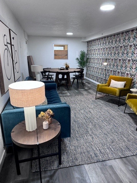 a living room with a blue couch and a table