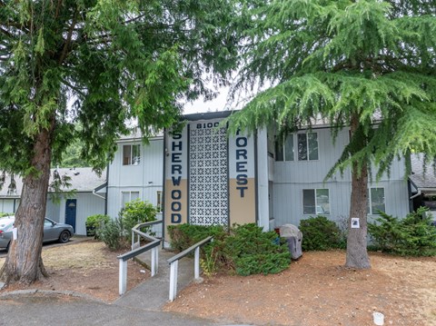 A tree is in front of a building with a sign that says "Bioforest".