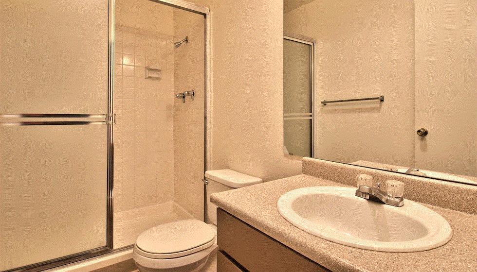 a bathroom with a sink toilet and a shower