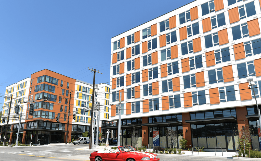 a red car parked in front of a building