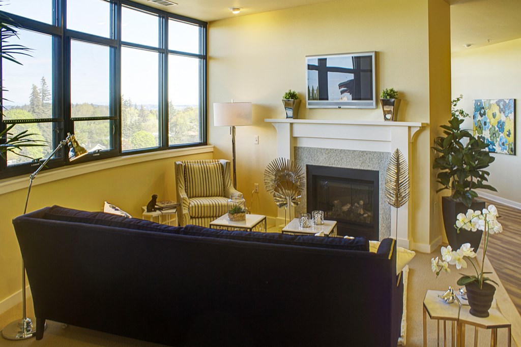 a living room with a couch and a fireplace