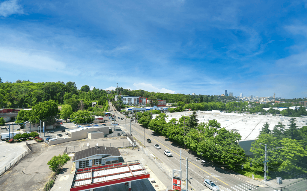 the view of the city from the roof of a building
