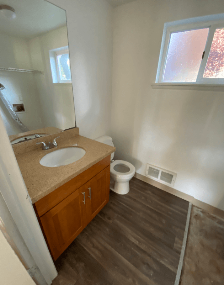 an empty bathroom with a sink and a toilet