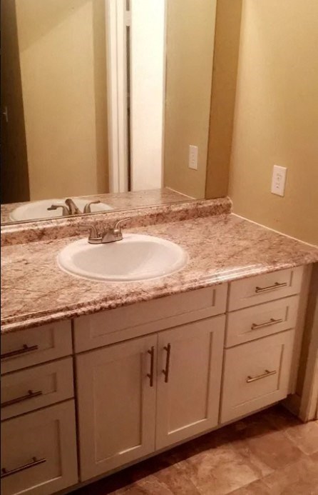 a bathroom with a sink and a mirror