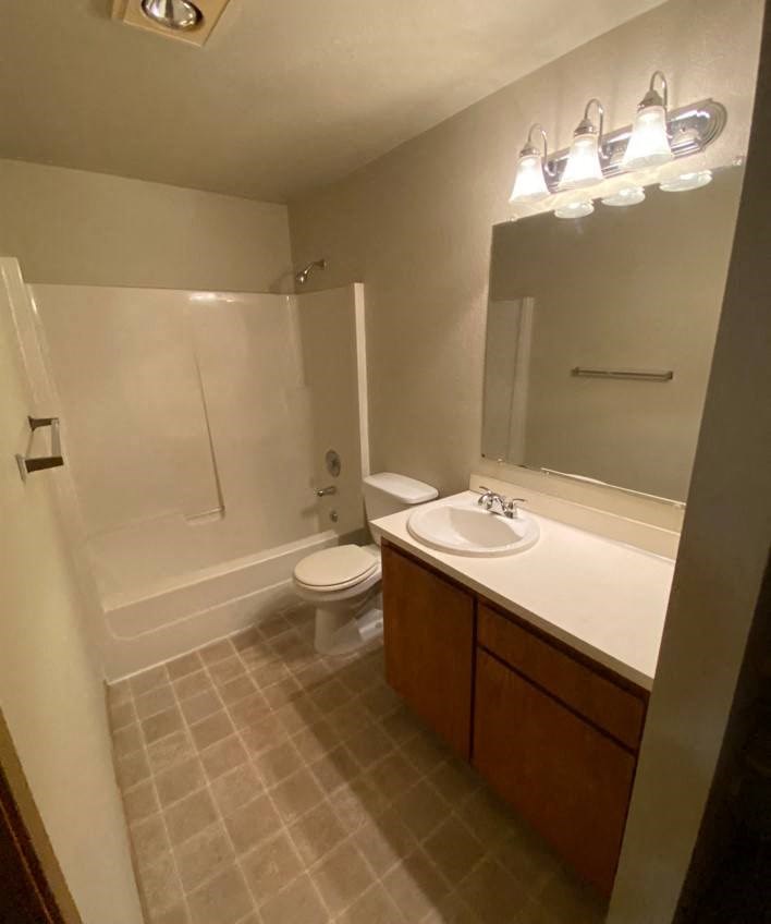 a bathroom with a sink toilet and a shower