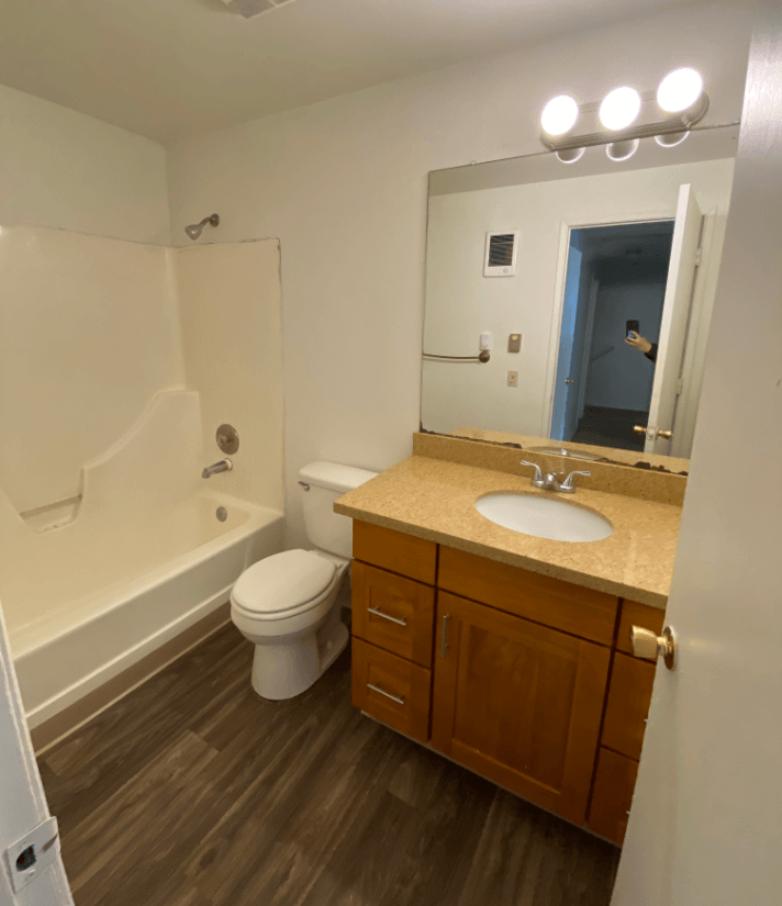 a bathroom with a sink toilet and bath tub