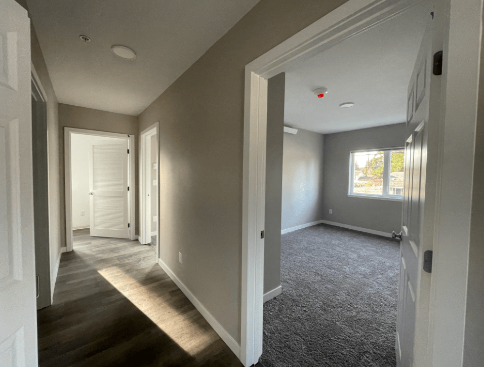 a view of a living room from the hallway of a house
