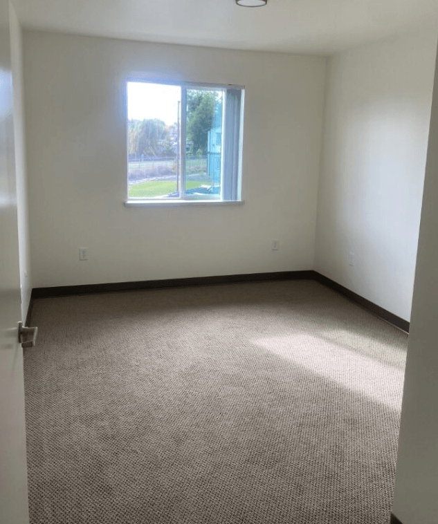 an empty room with a window in it