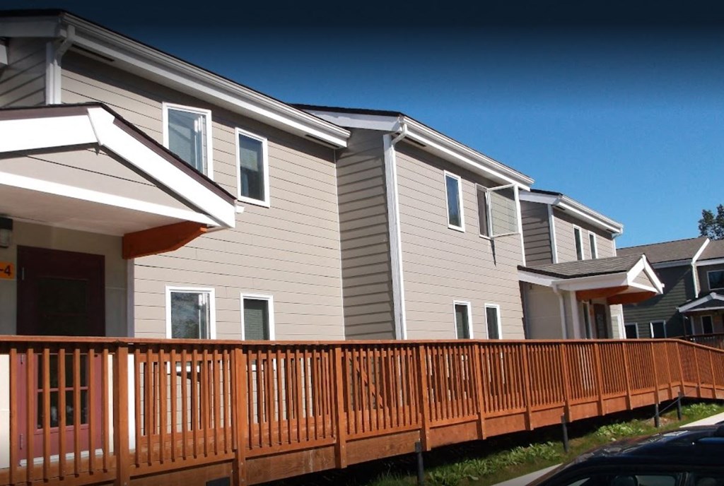 a row of houses with a wooden fence