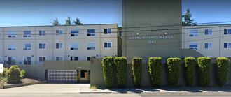 a large building with a street in front of it