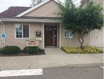 a building with a motel sign in front of it