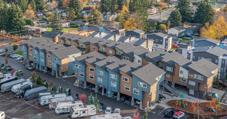 A large group of houses are shown from an aerial view.
