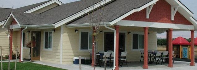 a house with a porch and a table and chairs