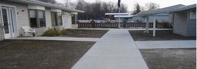 a sidewalk in front of a house