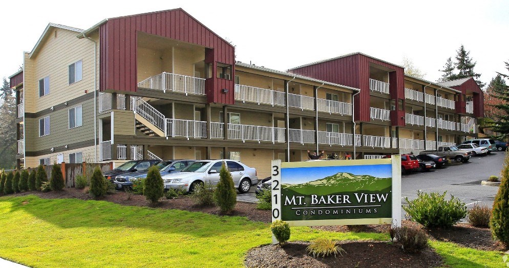 A sign in front of a building that says Mt. Baker View Condominiums.