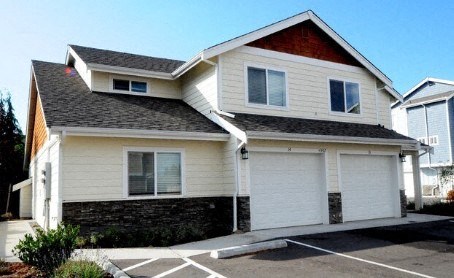 A two-story house with a garage.